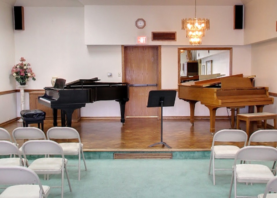 The recital hall at Day Murray Music, set up with chairs facing two grand pianos